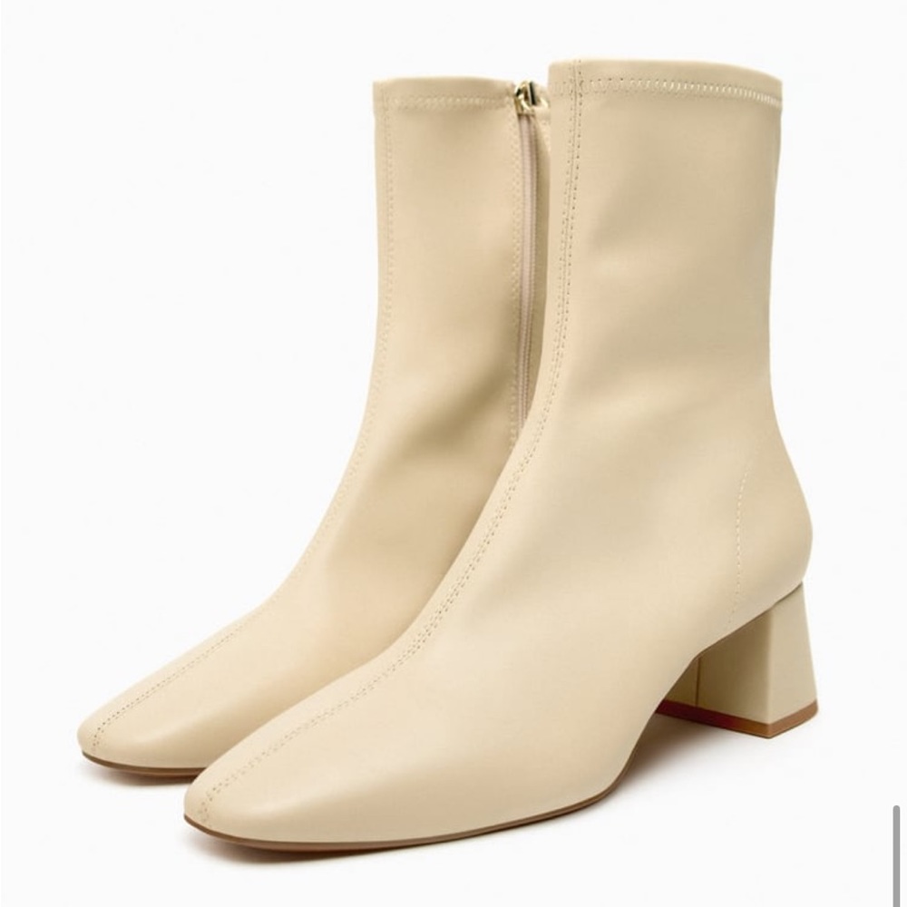 Cream wide heeled ankle boots.